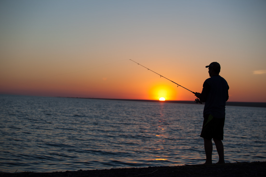 Fisherman-fishing-at-sunset-